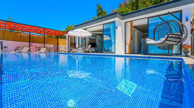 Kalkan Üzümlü Mevkiinde 4 Kişilik Korunaklı Tatil Villası